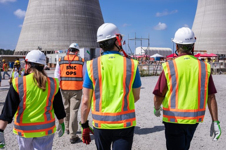 Engineers inspect a nuclear plant site, showcasing safety, oversight, and progress in North America’s clean energy transition.