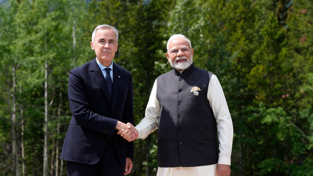 Prime Minister Mark Carney greets Indian Prime Minister Narendra Modi at the G7 Summit in Kananaskis, Alta., on Tuesday, June 17, 2025. THE CANADIAN PRESS/Adrian Wyld